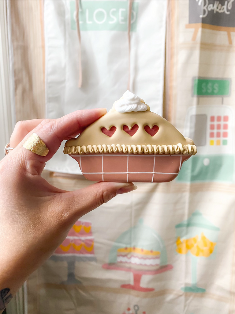 Sugar cookie shaped like a pie decorated with royal icing.  